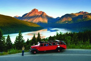 A red bus tour is a popular way to explore Glacier National Park.