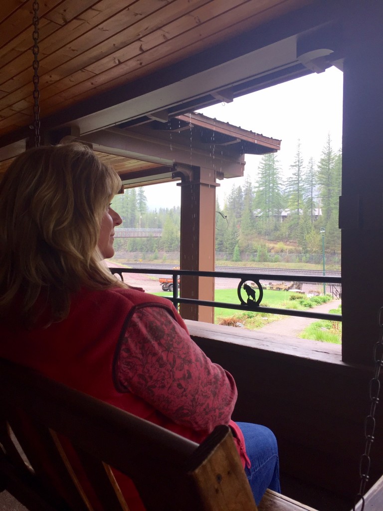 Watching trails roll past from the covered patio of the Izaak Walton Inn. 