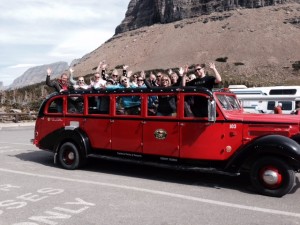 Red bus tour stop at the top of Logan Pass.