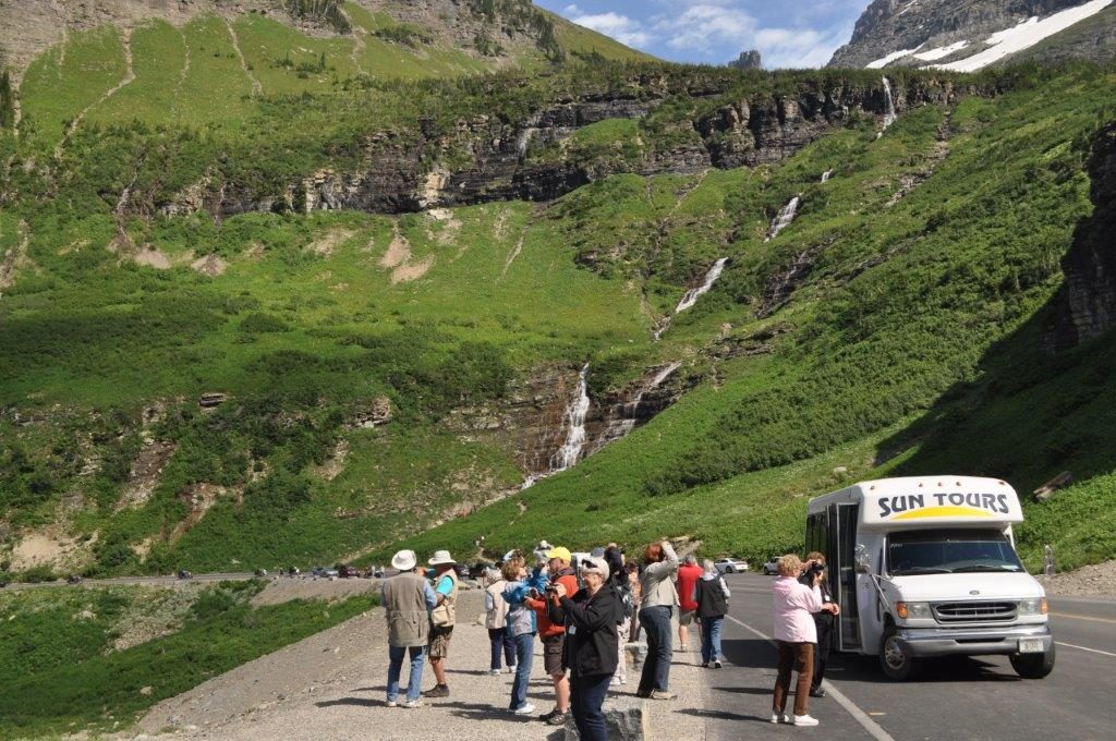 Tour guests take in the views along the Going-to-the-Sun Road. 