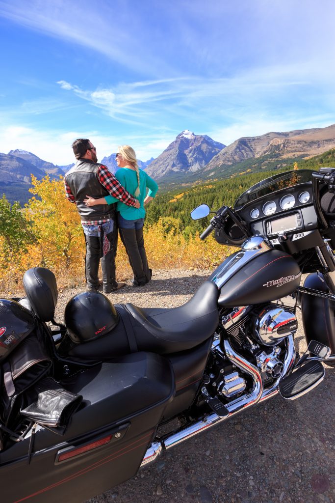 cowboy and his motorcycle with mountain views